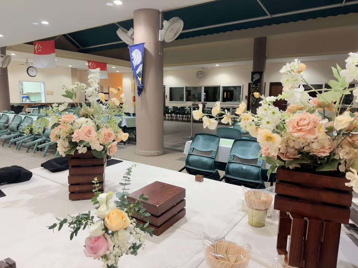 Rustic wooden crate table centerpieces at the reception dining area